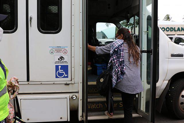 Elizabeth Kaleo climbs into the Handi-Van after finishing her dialysis treatment. 