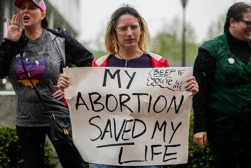 An abortion rights supporter protests in support of abortion rights near the Supreme Court of Ohio. The protest comes a day after a U.S. Supreme Court draft decision overturning Roe v. Wade was leaked. The 1973 landmark ruling protects a woman's right to choose to have an abortion. Joshua A. Bickel, Columbus Dispatch/USA TODAY Network