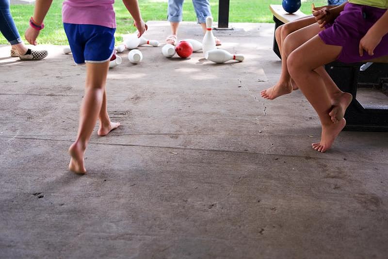 McAlvany's family plays at a meal site in Kirksville, Mo. Arin Yoon for NBC News