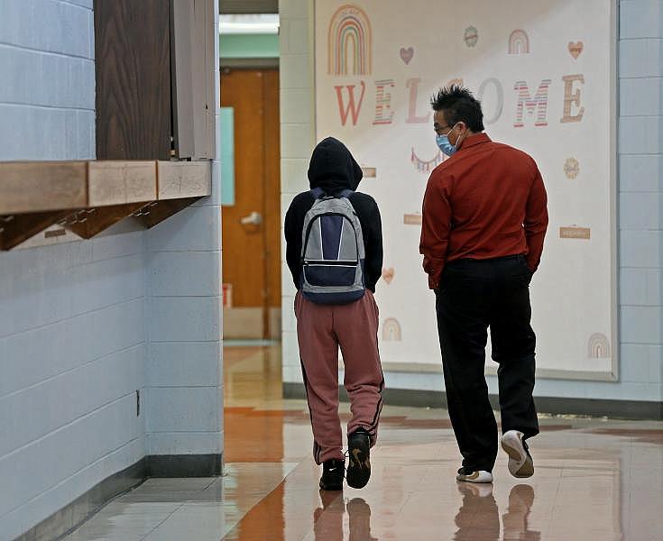 Assistant Principal Keith Omadahl, right, talks with a student at Starms Discovery Learning Center. ANGELA PETERSON / MILWAUKEE JOURNAL SENTINEL