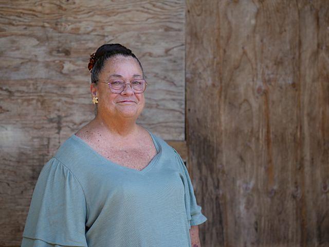 Norvana “Cissy” Miranda, standing outside her home on Oahu's North Shore, recently lost 70 pounds in order to start peritoneal dialysis, a type of at-home dialysis. 