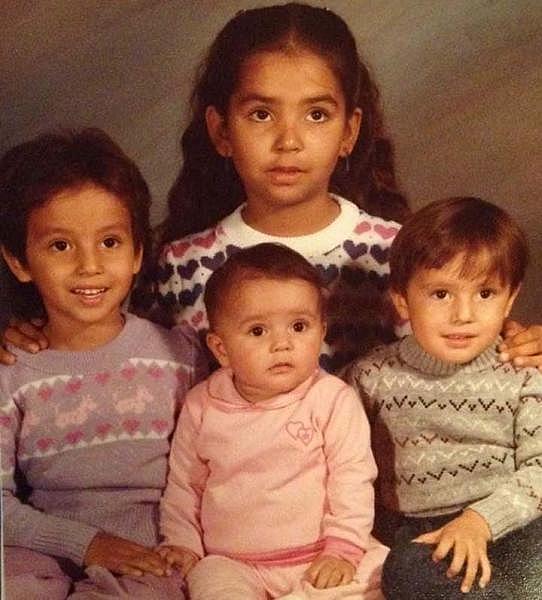 Toy at 8, with the siblings she grew up with. (Photo/Courtesy)