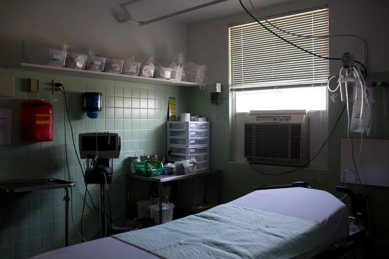 In this Thursday, July 30, 2015, photo, an exam room with a window air conditioning unit is shown at Wedowee Hospital, in Wedowee, Ala. BRYNN ANDERSON, AP