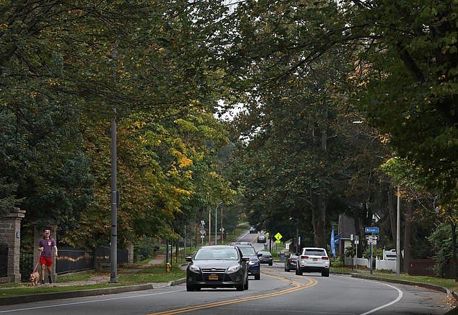 All kinds of traffic, both pedestrian and vehicular, move along under the lush tree canopy along Mt. Hope Avenue in Rochester Friday, Oct. 15, 2021. Shawn Dowd, Democrat And Chronicle All kinds of traffic, both pedestrian and vehicular, move along under the lush tree canopy along Mt. Hope Avenue in Rochester Friday, Oct. 15, 2021. Shawn Dowd, Democrat And Chronicle