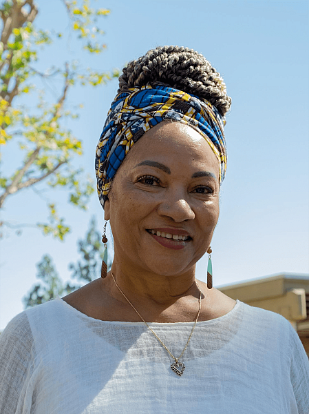 Karen Sykes smiles for a portrait during a visit with her client in Chino, CA.(Aryana Noroozi for Black Voice News/CatchLight Local). June 26, 2022.