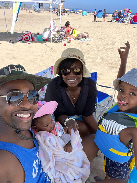 DeShawna “Shay” Wright is pictured with her husband, Dr. Louis Wright, and two children, Noni and Layden Wright at the beach (Image courtesy of DeShawna Wright).