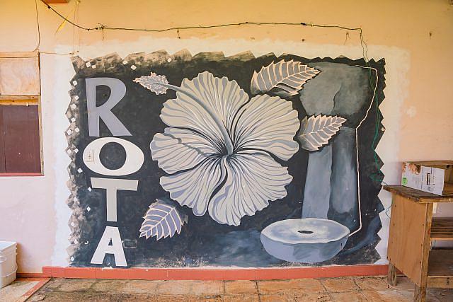A mural celebrating Rota decorates the interior courtyard of the Rota and Tinian guesthouse in As Lito, Saipan. Many patients must live here in order to get dialysis. 