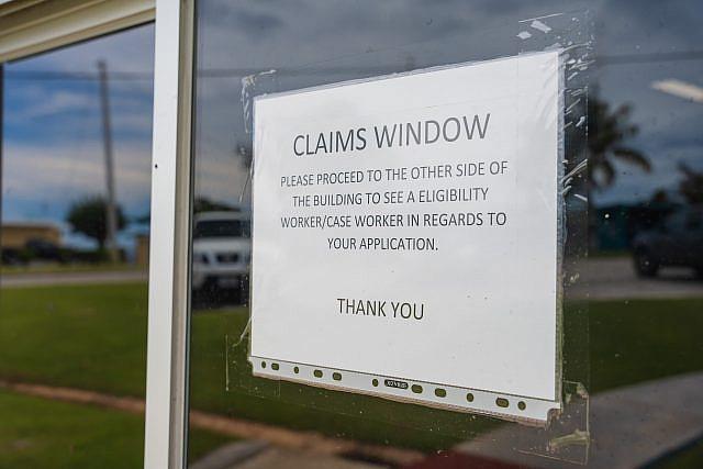 The Medicaid office on Saipan posts signs to manage the crowds of people who have signed up for the public health insurance program.