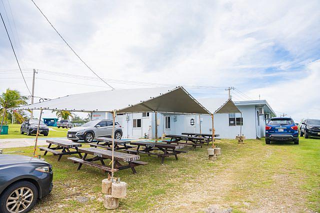 The Medicaid office on Saipan set up picnic tables outside to help manage the crowds of people who signed up for the public health insurance program. They’re rarely empty except when the office is closed. 