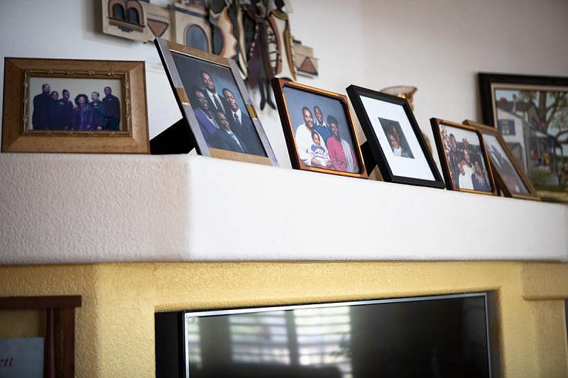 Family photos fill the living room of the Fisher home in Spring Valley, Aug. 16, 2022. (Zoë Meyers/inewsource)