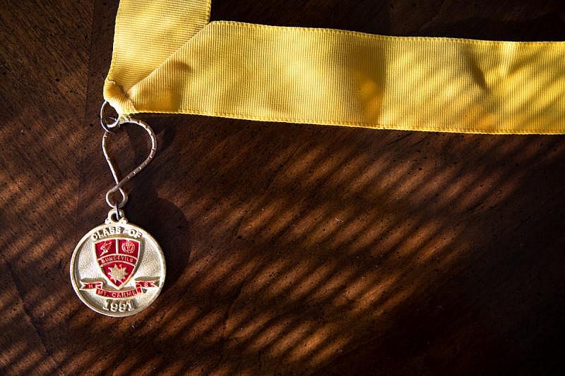 Objects like their son’s high school medal, photographed here at their San Diego home, are reminders to Mike and Mimi Murray of the achievements in their son’s past, Aug. 22, 2022. (Zoë Meyers/inewsource)