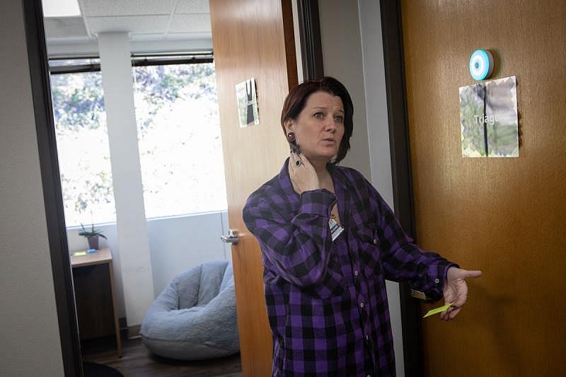MJ Jacquot works in the triage department of the Telecare Mobile Crisis Response Team office in San Diego, Sept. 1, 2022. Mobile crisis response teams partner with local law enforcement and dispatch behavioral health experts to assess, de-escalate and connect people with services. (Zoë Meyers/inewsource) MJ Jacquot works in the triage department of the Telecare Mobile Crisis Response Team office in San Diego, Sept. 1, 2022. Mobile crisis response teams partner with local law enforcement and dispatch behavioral health experts to assess, de-escalate and connect people with services. (Zoë Meyers/inewsource)