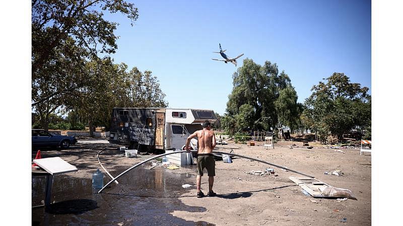 Hernandez moves a pipe around his encampment on West Hedding Street on Tuesday, Sept. 6, 2022. (Shae Hammond/Bay Area News Group) 