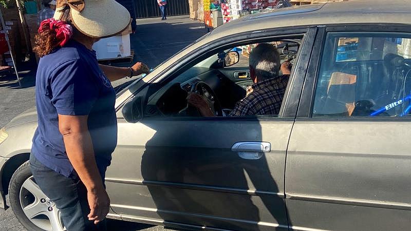 A volunteer helps with intake during a food distribution at Vida Life Ministries in Bloomington, California on July 16, 2022. (Photo by Javier Rojas/Inland Valley Daily Bulletin/ SCNG)