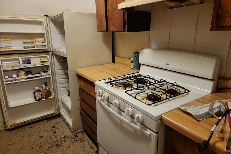 Kanesha Head’s unit at Sunset Village, on the night of Oct. 15, was in a state of disrepair, and crawling with insects. Head, six months pregnant, fears for her safety if she is made to return. Photo by Nick Judin Kanesha Head’s unit at Sunset Village, on the night of Oct. 15, was in a state of disrepair, and crawling with insects. Head, six months pregnant, fears for her safety if she is made to return. Photo by Nick Judin