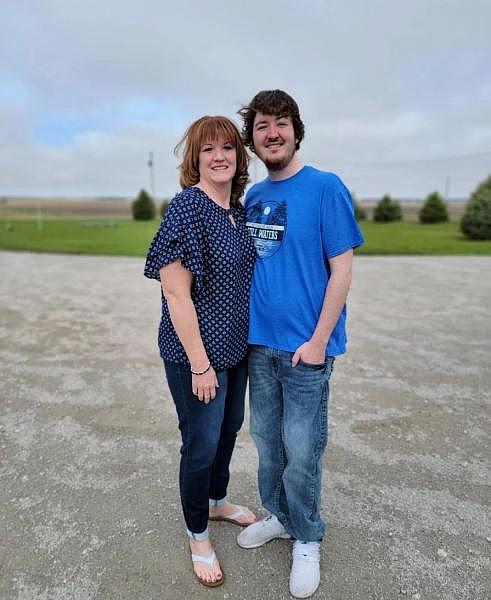 Nick Herringer and his mother Tammy Herringer stand in front of their house northwest of Hastings. Their water, drawn from their privately drilled well, showed a nitrate level of 18 parts per million earlier this year, much higher than the EPA limit of 10 ppm. Courtesy photo