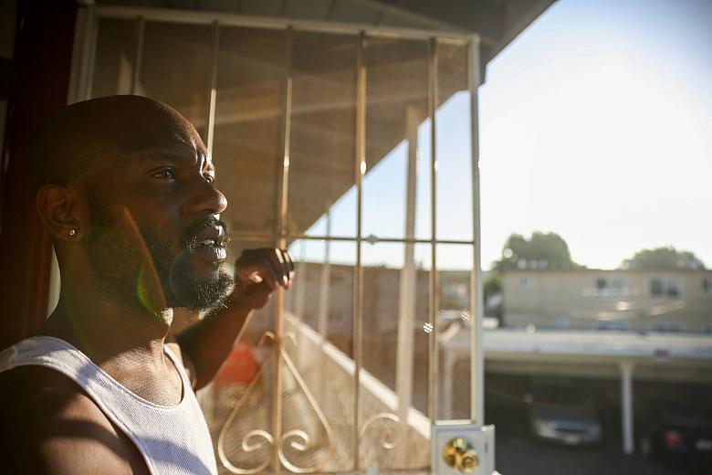 Henderson looks out of his new apartment in San Jose on Thursday, July 22, 2022. (Shae Hammond/Bay Area News Group)