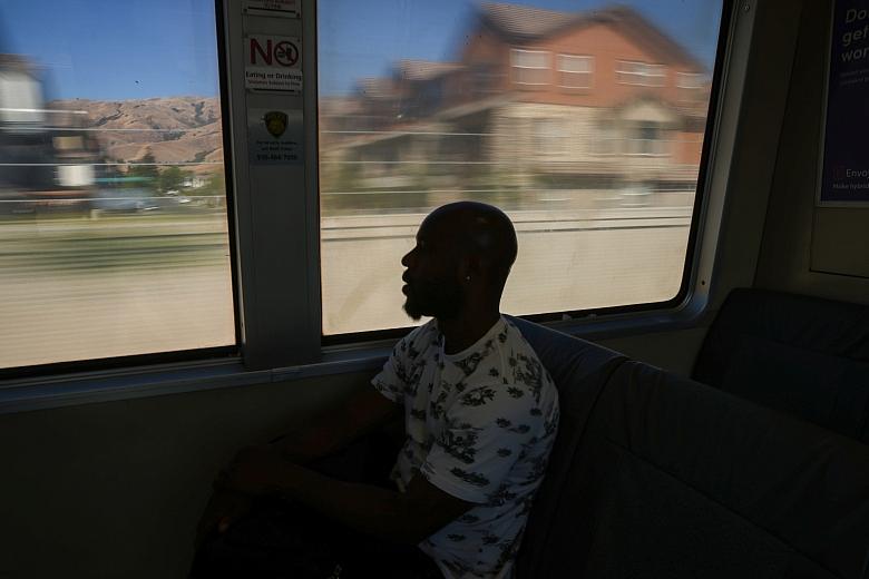 Henderson takes the train from the Berryessa Station near his tiny home to work in San Jose on Sunday, July 10, 2022. Henderson works the night shift at a Tesla factory. (Shae Hammond/Bay Area News Group)
