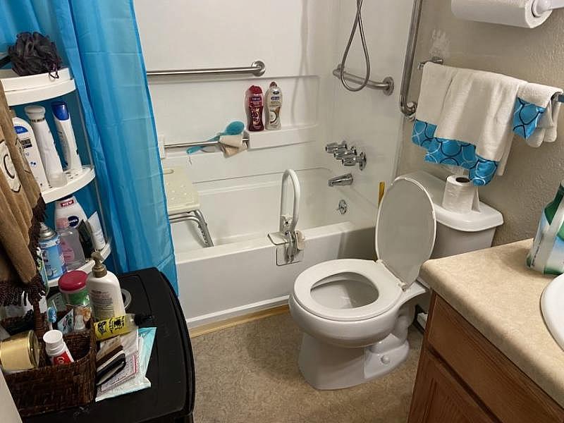 Carolyn's bathroom. She has requested a taller toilet seat for three years because she falls when she uses it alone. Carolyn's bathroom. She has requested a taller toilet seat for three years because she falls when she uses it alone.