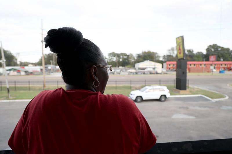 Vonetta McCoy stands outside her room at the Super 6 in Cleveland, Miss. on Oct. 10. McCoy, a resident at the Sunset Village Apartment Complex, shared a letter warning of an impending eviction she received while displaced from her apartment. Photo by Nick Judin