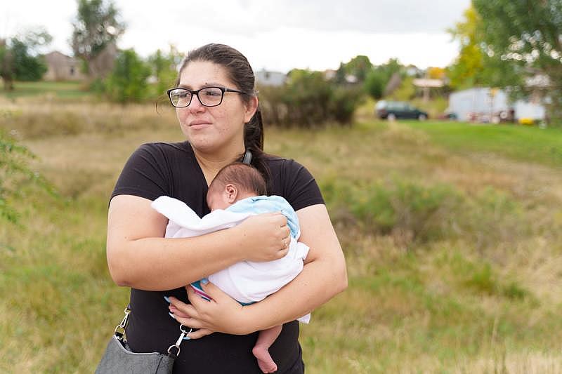 Cassandra Big Crow, 29, has always wanted to be a mother, to “feel like I have purpose.” She applied for Medicaid when she became pregnant, but state officials denied her request because of her income as an independent contractor. Even among pregnant people, the state has the strictest income limits in the U.S. for Medicaid. Applicants have to make no more than 138 percent above the federal poverty line, which is less than $18,000. Photo by Hope Schumacker for the PBS NewsHour Cassandra Big Crow, 29, has always wanted to be a mother, to “feel like I have purpose.” She applied for Medicaid when she became pregnant, but state officials denied her request because of her income as an independent contractor. Even among pregnant people, the state has the strictest income limits in the U.S. for Medicaid. Applicants have to make no more than 138 percent above the federal poverty line, which is less than $18,000. Photo by Hope Schumacker for the PBS NewsHour