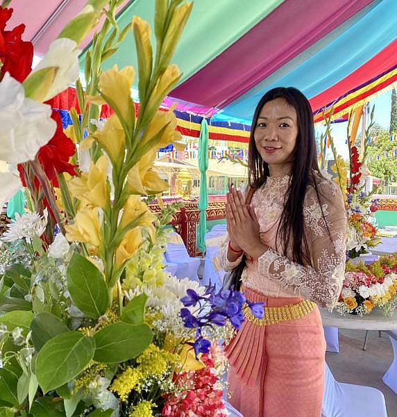 Nancy Meas prepared the bouquet of flowers that adorned the temple for the Holy Water Blessing at the Cambodian Buddhist Temple, July 2 in Fresno, Calif.