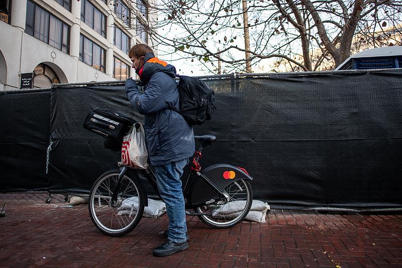 Christopher waits in line to get in to the Tenderloin Linkage Center in San Francisco on Feb. 8, 2022. (Beth LaBerge/KQED)