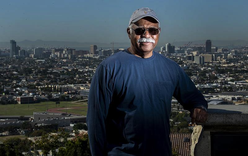 Theral Golden, treasurer of the Westside Neighborhood Association and an air quality activist, stands at Hilltop Park overlooking Downtown Long Beach on Oct. 15, 2021. Photo by Thomas R. Cordova.