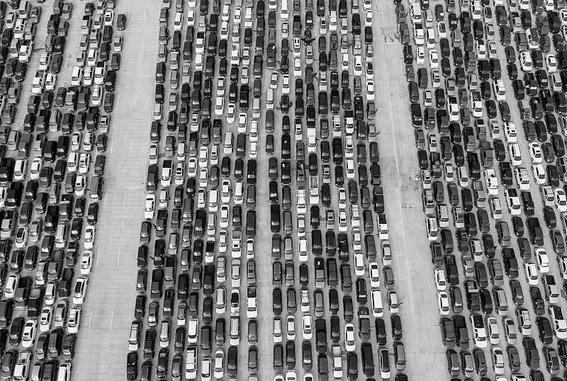 People wait in their cars in April 2020 at Traders Village for the San Antonio Food Bank to distribute food. The need for emergency food aid exploded due to the COVID-19 pandemic, which public officials said exacerbated the existing economic and health care disparities in San Antonio.  William Luther, Staff / Staff