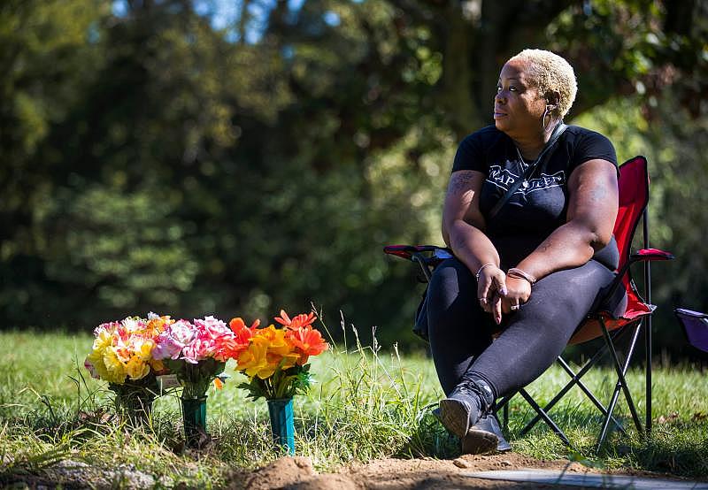 Tracey Jones visits her daughter's grave, Sept. 26, 2021. Patricia Woods, 24, was killed April 17, 2020, in what police believe was a domestic violence homicide. "How does a mom get over the death of her daughter? I just don't know how to do it." Jones now has custody of Woods’ two children. LIZ DUFOUR/THE ENQUIRER