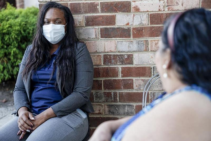 Shanteny Jackson chats with Doña Rosa on Wednesday, November 17, 2021 at Southwood Apartments in Richmond, Virginia.  SHABAN ATHUMAN/TIMES-DISPATCH