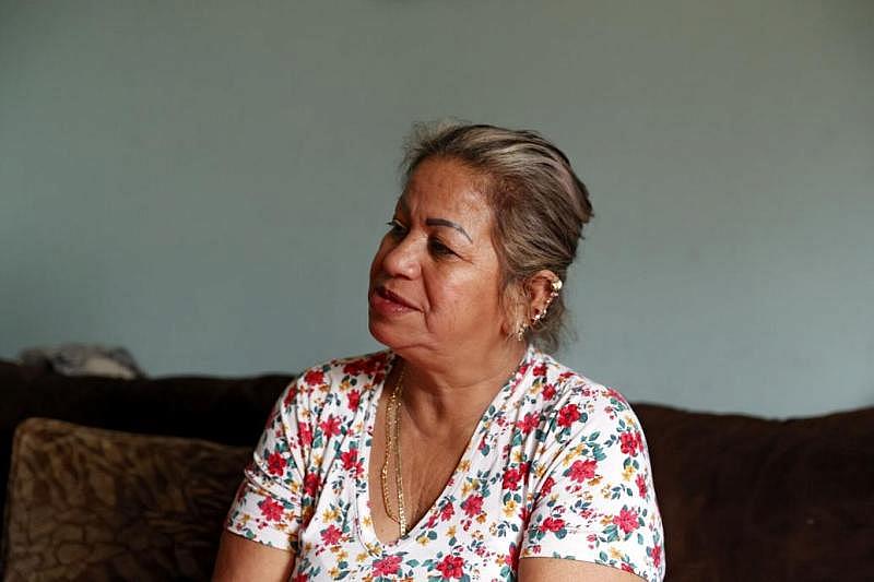 It's been nearly two years since Maria Fuentes last held her husband's hand. Sometimes, she still reaches for it. Sometimes, she peeks out her door at 5 p.m. when the construction crews start arriving home as if he'll be among them. Instead, there's only the reminder of the virus that killed him. Eva Russo/Times-Dispatch It's been nearly two years since Maria Fuentes last held her husband's hand. Sometimes, she still reaches for it. Sometimes, she peeks out her door at 5 p.m. when the construction crews start arriving home as if he'll be among them. Instead, there's only the reminder of the virus that killed him. Eva Russo/Times-Dispatch