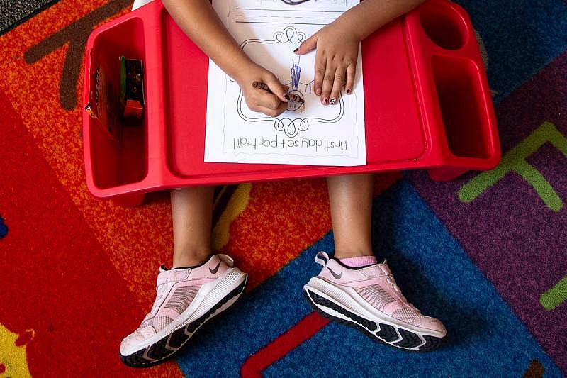 Rubi Cardozo paints a self-portrait on her first-ever day in a classroom at Freedom Elementary School in Buckeye on Aug. 4, 2021. BENJAMIN CHAMBERS/THE REPUBLIC