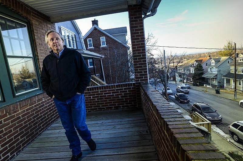 Lehigh University Professor Seth Moglen has called Hillside Avenue, in Bethlehem home since 1999. Here he walks on his front porch Wednesday, February 9, 2022. Donna Fisher | lehighvalleylive.com contributor