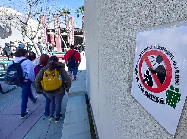 Students walk past one of the many anti-bullying signs posted around Harry S. Truman Middle School in Fontana on Thursday, March 17, 2022. (Photo by Will Lester, Inland Valley Daily Bulletin/SCNG)
