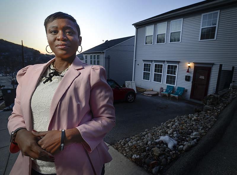 Lidia Gonzalez realized her dream of home ownership in South Bethlehem with the help of two nonprofits. Here she stands in front of her home Wednesday, February 9, 2022. Donna Fisher | lehighvalleylive.com contributor