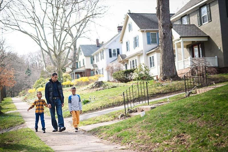 Malik Evans walking with his sons near his home on Nunda Boulevard in the Cobbs Hill neighborhood, one of the leafiest areas of the city. PROVIDED PHOTO