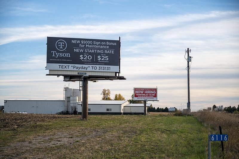 Signs around town advertises higher wages and sign on bonuses to attract more workers as the industry is experiencing a workforce shortage. Natalie Krebs / IPR