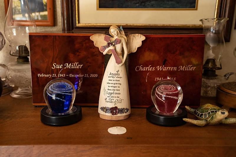 Shana Driver keeps the ashes of her mother, Sue Miller, and father, Charles Miller, and ornaments made in their memory at her home outside Kokomo, Indiana. HANNAH GABER, USA TODAY