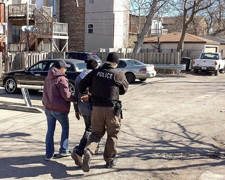A man caught with a small baggie of heroin is taken into custody by Chicago police officers in the 3600 block of West Flournoy Avenue in 2018. He was offered the chance of going into drug treatment instead of jail. Frank Main / Sun-Times A man caught with a small baggie of heroin is taken into custody by Chicago police officers in the 3600 block of West Flournoy Avenue in 2018. He was offered the chance of going into drug treatment instead of jail. Frank Main / Sun-Times
