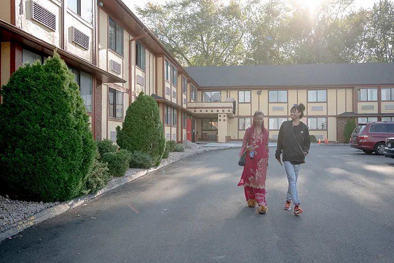 Tanya and Dexter walk out of a motel that they were staying at. Before they moved into the motel after eviction, they spent a couple of nights under the bridge. Without having cooking furniture, they had to rely on instant food. YEHYUN KIM / CTMIRROR.ORG