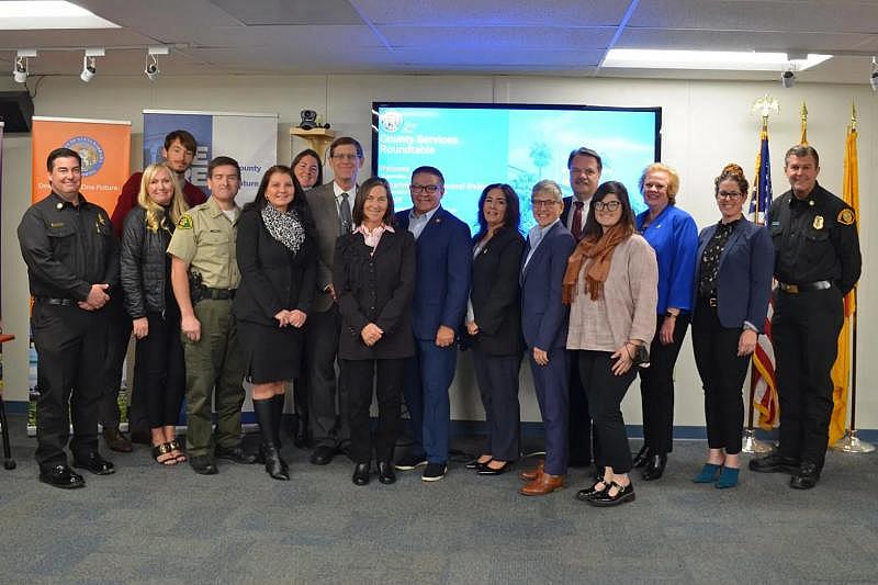 Santa Barbara County department heads and staff stand with Congressman Salud Carbajal, center, after a sobering center tour and roundtable discussion on mental health programs on Dec. 19.  Giana Magnoli / Noozhawk photo
