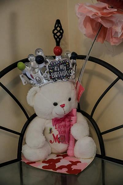 A teddy bear that her son gave her this year is displayed in her bedroom