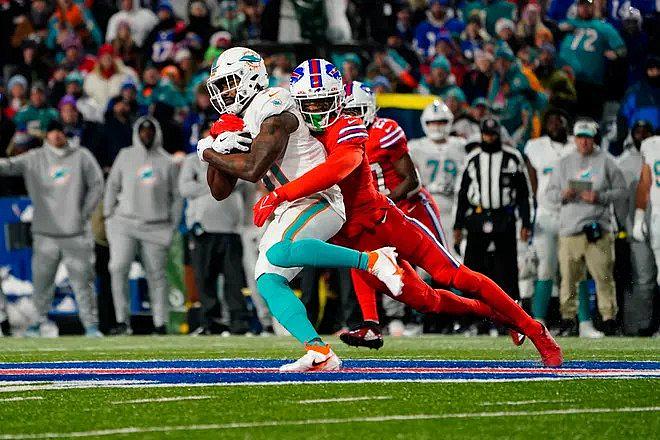 Buffalo Bills safety Damar Hamlin (3) tackles Miami Dolphins running back Raheem Mostert (31) running with the ball during the first half at Highmark Stadium. Gregory Fisher, USA TODAY Sports