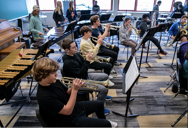 MANDI WRIGHT, DETROIT FREE PRESS Bennett Solomond plays trumpet with his North Allegheny Intermediate High School classmates during band on Nov. 2, 2022. Bennett, now, 15, was secluded in elementary school and middle school while in Michigan. For better services, his family moved to western Pennsylvania, where his parents say Bennett is thriving in school.