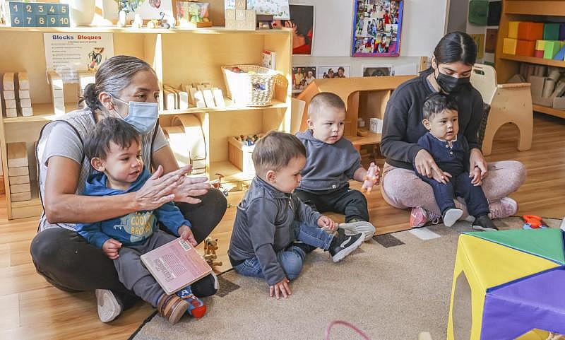 The children and teachers sing their good-morning song at Miren Algorri’s family child care.(Eduardo Contreras / The San Diego Union-Tribune)