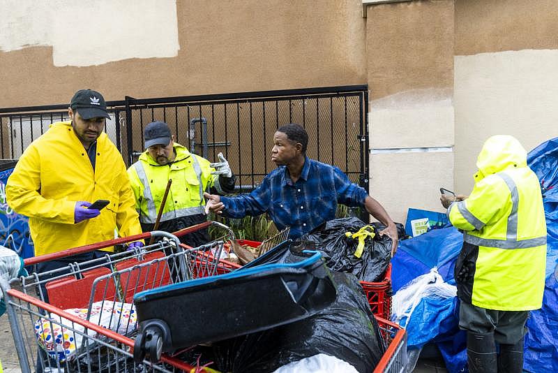 Los Angeles, CA – Feb. 14: Tony Shaw of Koreatown urgently sorts his belongings to prevent sanitation workers from taking his property on February 14, 2019. (Brian Feinzimer)
