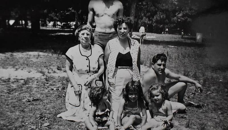 A family poses at Wood Island on a hot summer day.