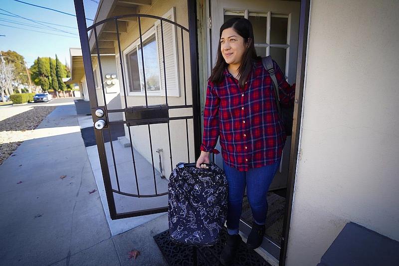Zaira Reynoso prepares to head to the grocery store with Ander.(Nelvin C. Cepeda / The San Diego Union-Tribune)