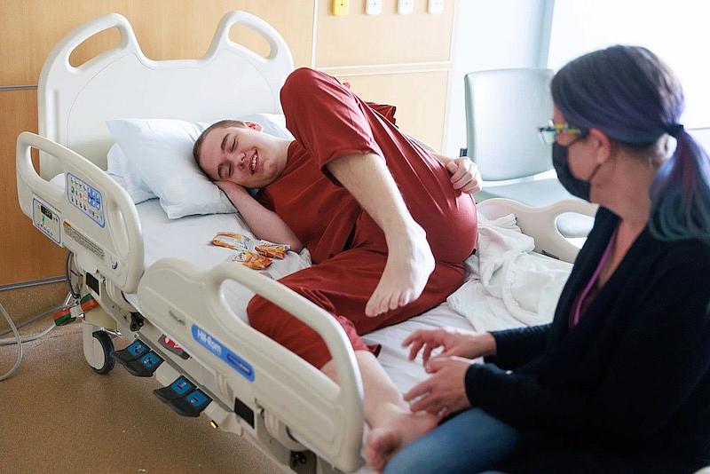 Jack laughs as his mom tickles his feet. “He’s definitely a mama’s boy,” she says. “He’s very affectionate.” (Erika Schultz / The Seattle Times)